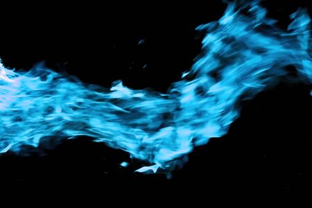 Cyan fire flames from the burning gas isolated on the black background. Symbol of energy and power.の写真素材