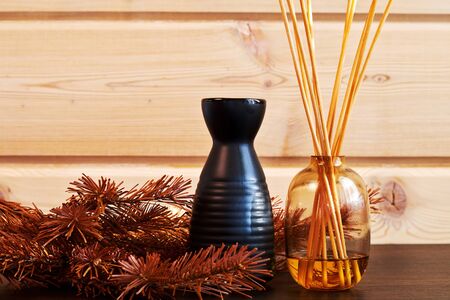 Relaxed atmosphere with aromatherapy equipment and cosmetics on the wooden table. Spa and healthcare backgrounds. Traditional medicine and homeopathyの写真素材