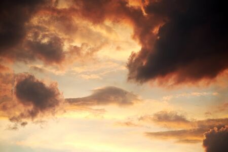Dramatic twilight sky with clouds. Colorful cloudscape and atmosphere. Vivid sunset lights in the...