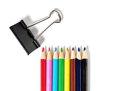 Rainbow colored pencils and paper clips isolated on the white background. Office supply and...