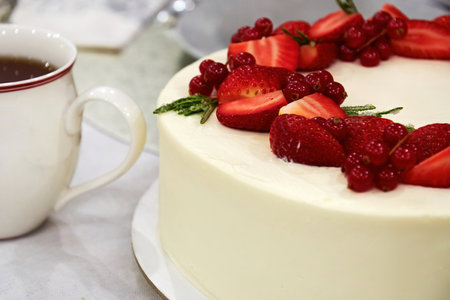 Baked strawberry cheesecake ready to eat over a cup of tea. Sweet food and desserts backgroundsの写真素材