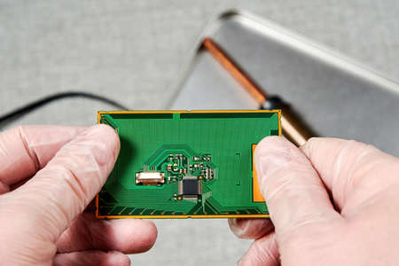 An engineer working on microchip development in tech laboratory. Manufacturing and nanotechnology...