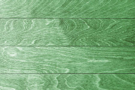 The texture of light green natural wooden surface with hardwood boards. Hardwood texture. Empty backdrops and template with copy spaceの写真素材
