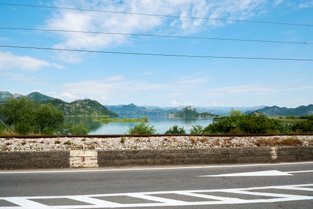 Expressway with markings along the shore of a mountain lake. Beauty scenic placesの写真素材