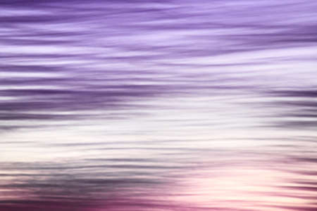 Abstract violet wavy cloudy sunset sky background. Beauty nature backdrops and patterns