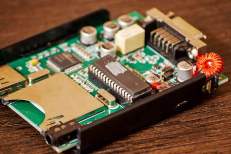 Small PCB with USB and processor on the engineer table. Technologies, electronic and computing...