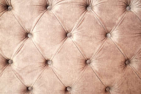 Background texture of draped sofa back with velveteen and buttons. Abstract interiors backgroundsの写真素材