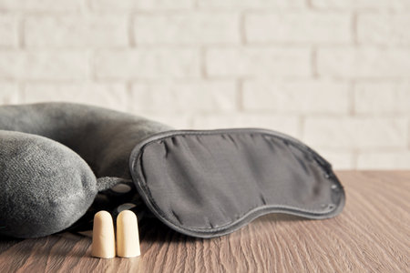 Sleeping blindfold mask, earplugs, pillow for insomnia. Sleep care and symbolsの写真素材
