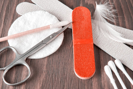 Manicure equipment and instruments on the wooden table. Salon desk closeup viewの写真素材