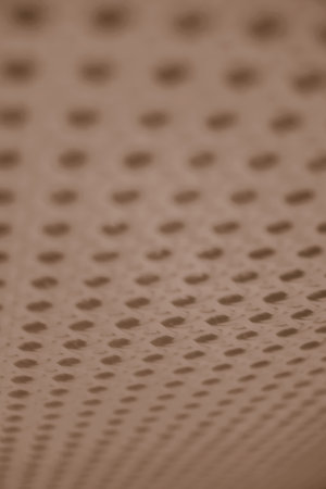 Abstract blurred spotted brown pattern texture with holes on the surface. Backgrounds and wallpapers