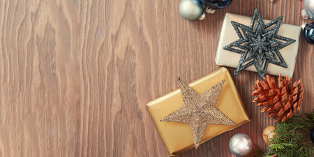 Web banner with Christmas ornament decoration on the wooden desk. Template with copy space for textの写真素材