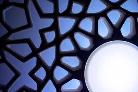 Abstract geometric image of sun and sunbeams in blue light color. Abstract ethnic figures and...