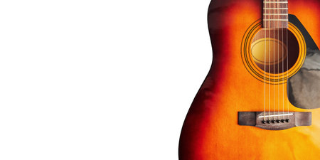Wide banner with isolated acoustic guitar from red wood with latoon strings. Musical instruments and music backgrounds. Copy space for textの写真素材