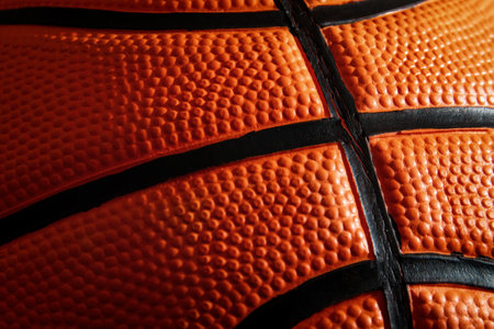 Macro view of textured leather basketball surface. Streetball and hoops. Sports patterns and...