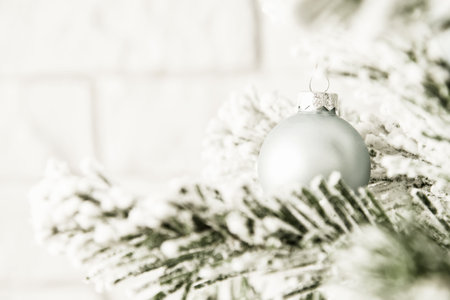 Festive Christmas tree branch with ornate blue toy balls and baubles. Holidays and festive events backgrounds. New Year celebrationの写真素材