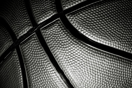 Detailed macro black and white texture of official leather basketball. Streetball and hoops. Professional sports backgroundsの写真素材