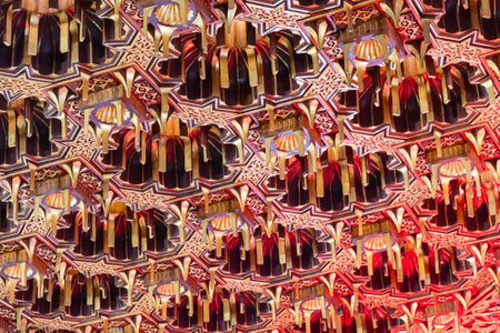 Detailed ornate ceiling with geometric and floral patterns in gold and red tones. Design showcases...