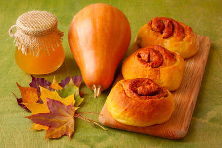 pumpkin muffins, honey and leavesの写真素材