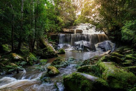 Phonpob waterfall, a beautiful waterfall in a forest filled with green trees at Phu Kradung National...