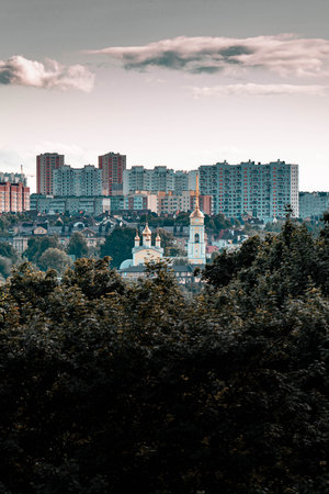 Panoramic view of Kaluga city showing an old church contrasting with new high-rise buildings, blending history and modernityの写真素材