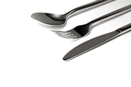 Spoon, plug, knife on a white backgroundの写真素材