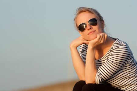Evening, sunset and the beautiful girlの写真素材