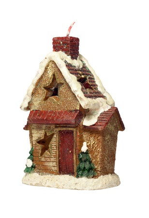 Candle in the form of a small house on a white backgroundの写真素材