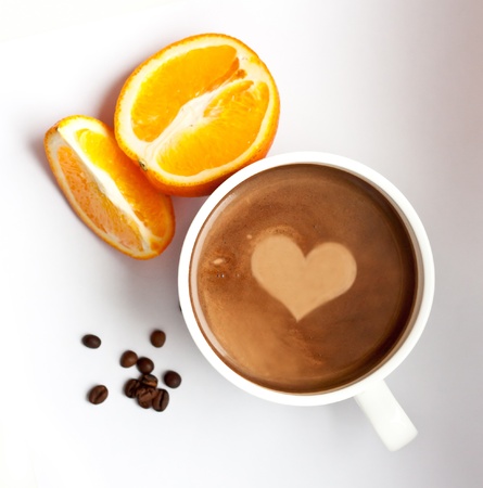 Composition whith a cup of coffee, coffee grains and orange, top lookの写真素材
