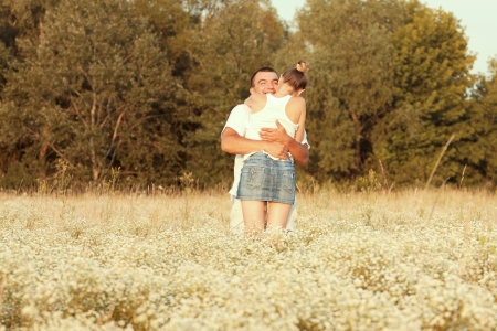 Happy couple enjoying life in the field, playing outdoorsの写真素材