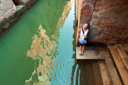 Girl tourist enjoys views of Veniceの写真素材
