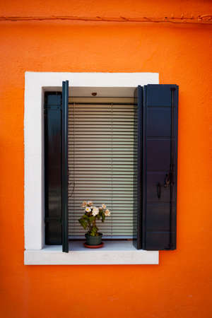 Window one of the colored houses in Burano, Venice, Italyの写真素材