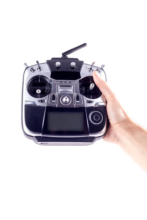 Remote control radio model in the hands of man on a white background.の写真素材