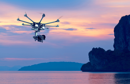 Flying copter with their gear on the background of a beautiful sunset.