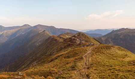 The mountain range in Ukraine. The road in the mountains. Travel along the ridge. Beautiful scenery highlandsの写真素材