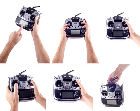 Remote control radio model in the hands of man on a white background.