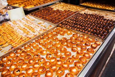 Counter with a variety of pastries and sweets, mini croissants with chocolate in the Mahane Yehuda Market in Erusalem. Israelの写真素材