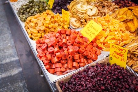 Close-up of different dried fruits in metal boxes. The counter on the Mahane Yehuda Market in Jerusalem, Israel.の写真素材
