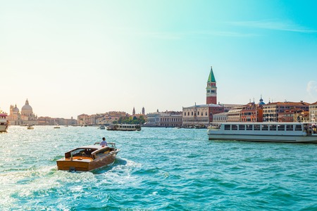 View of the Campanile in San marco's square and embankment from the sea in Venice, Italy.の写真素材
