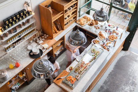 Interior of a small cafe with breakfasts in loft-style