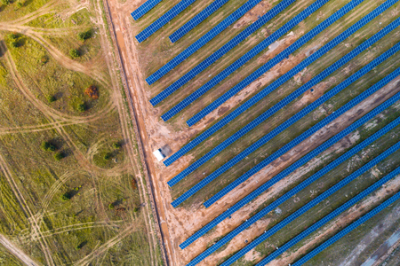 Solar panels placed on a countryside meadow.