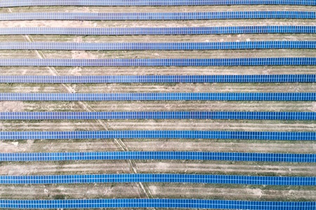 Solar panels placed on a countryside meadow.