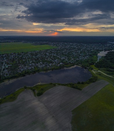 Panorama of countryside with a beautiful lake at sunset.の写真素材