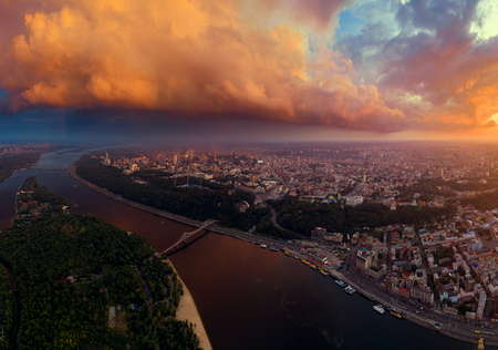 Beautiful panorama of the city of Kiev from the air. The Dnieper River and the two banks of the city at sunset. Trukhanov Island and Footbridge.の写真素材