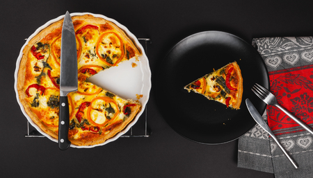 Homemade cheesy egg Quiche for Brunch with spinach and pepper.の写真素材