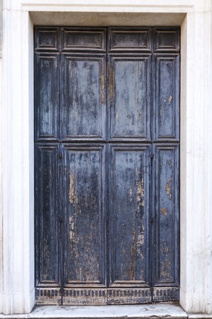 Isolated old door in gray and blue colors.の写真素材