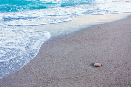 Blue waves in the sandの写真素材