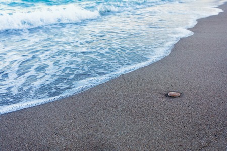Blue waves in the sandの写真素材