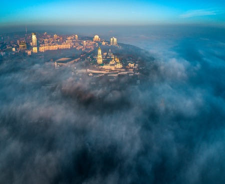 Aerial view of the right bank of Kiev covered with thick fogの写真素材