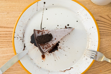 Cheesecake with chocolate biscuits and chocolate toppingの写真素材