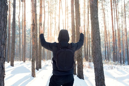 A man walks through the winter forestの写真素材